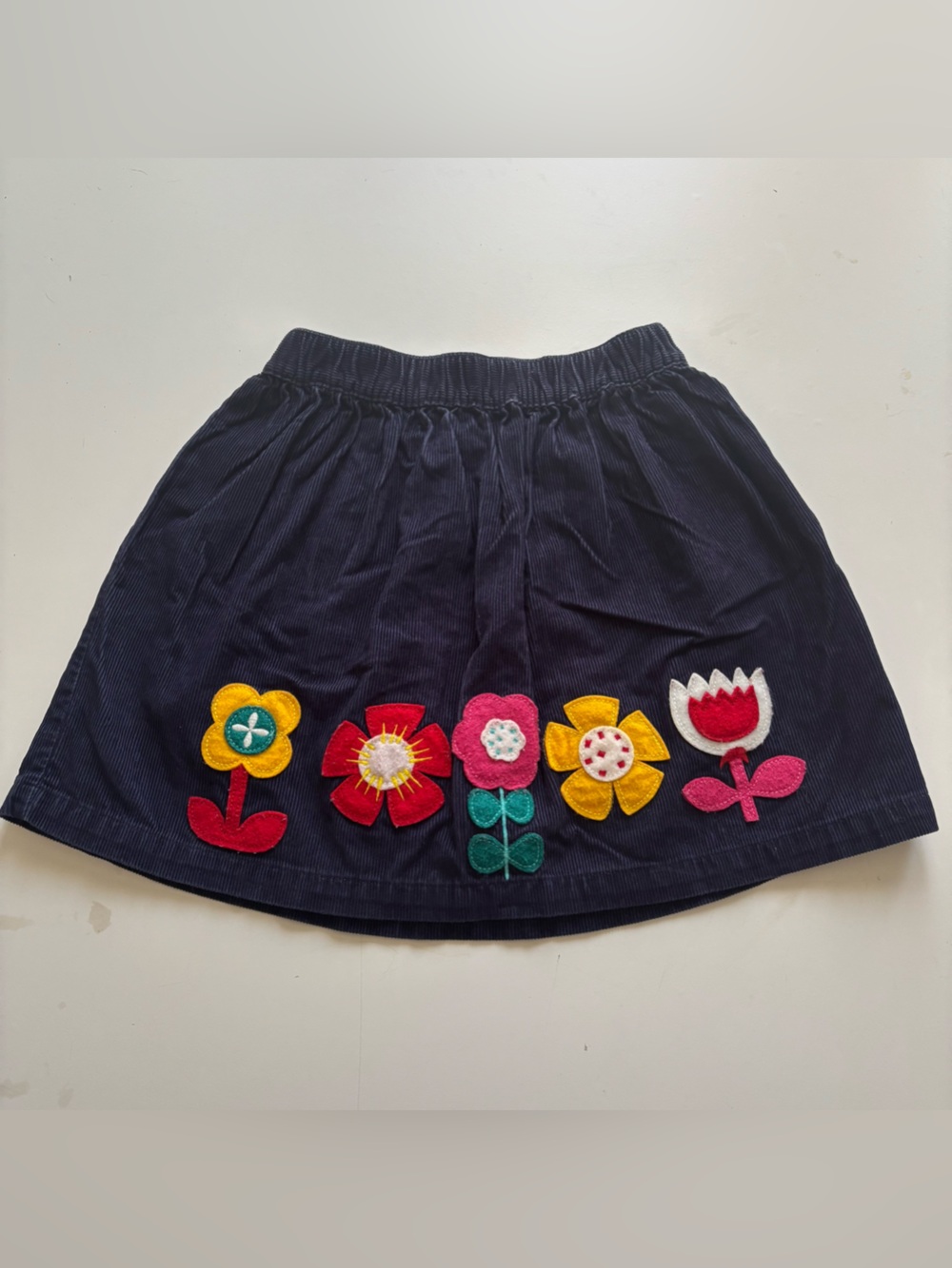 Hanna Andersson blue corduroy skirt with floral appliqué patches size 120 US 6-7